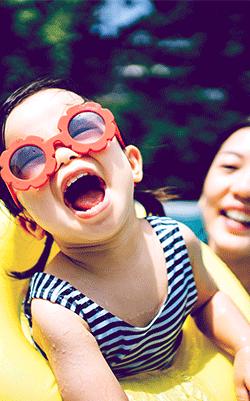 Mother and daughter in a swimming pool