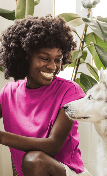 woman in pink with her dog