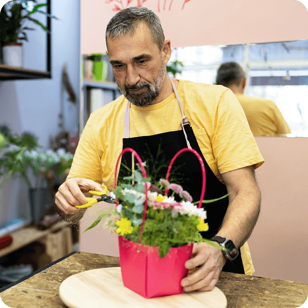 A man cutting flowers